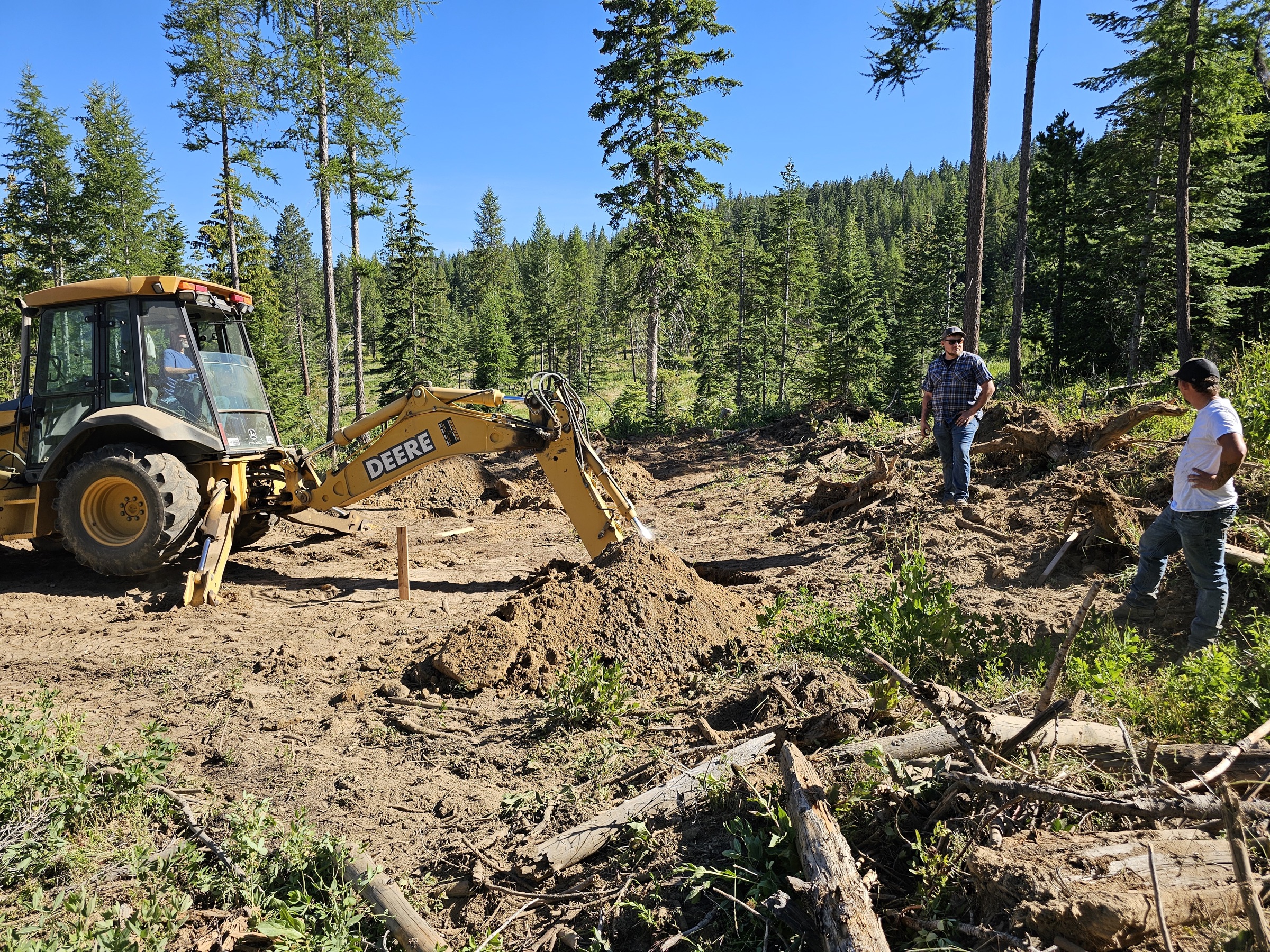 Volunteers and equipment preparing the accessible hunting blind site