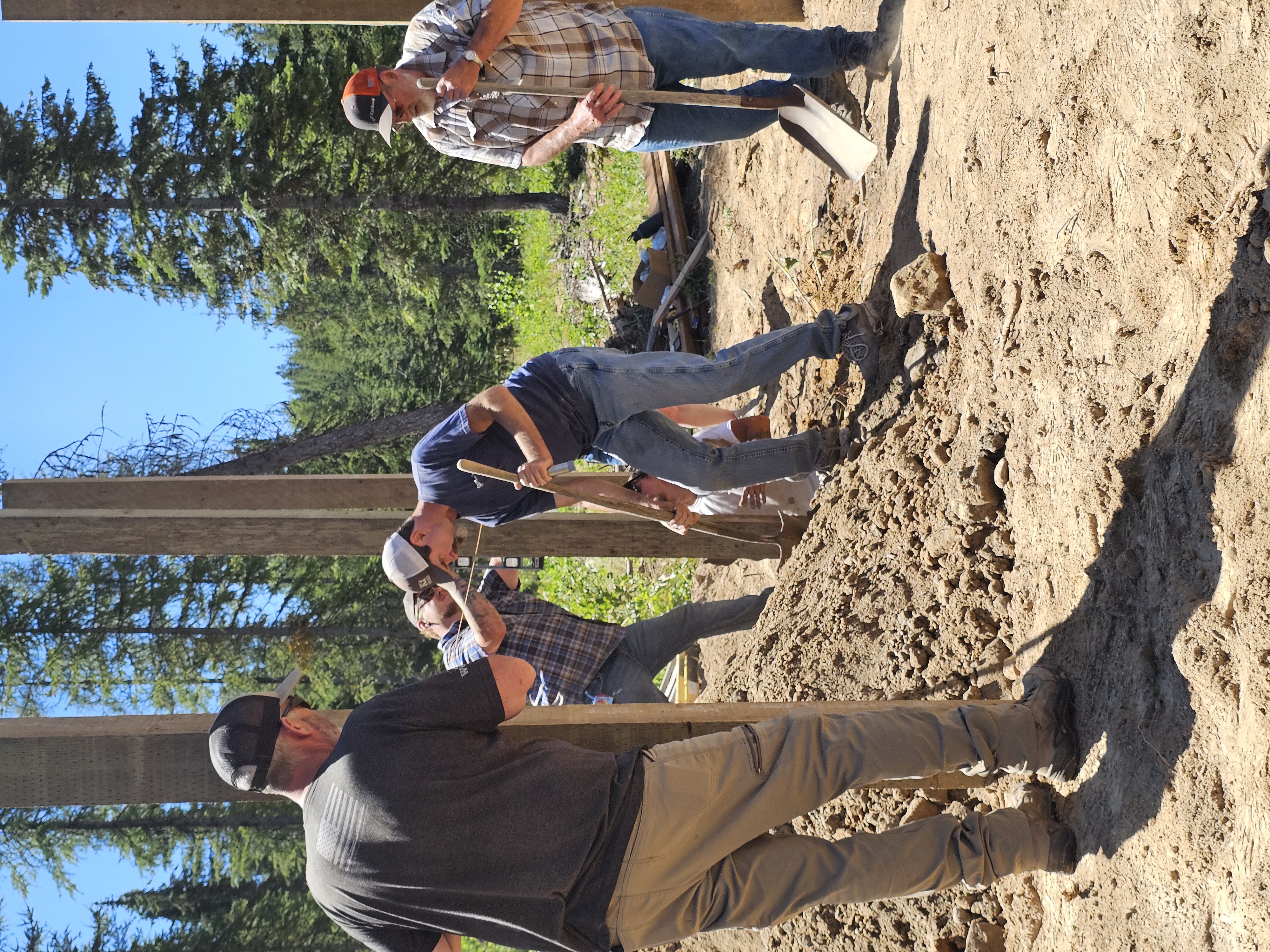 Foundation volunteers building an outdoor access structure in the forest